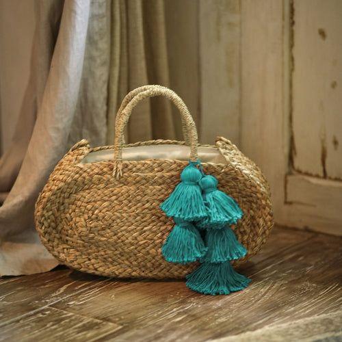 Load image into Gallery viewer, Oval Luna Straw Tote Bag - with Cerulean Blue Tassels
