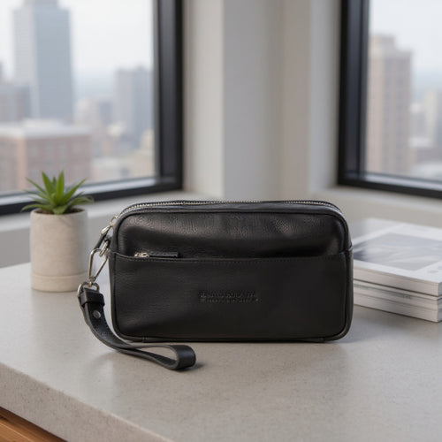 Load image into Gallery viewer, RB0046A | Pochette Uomo KEVIN con laccio da polso in Vera Pelle pieno fiore con leggera grana. Maniglia removibile. Colore Nero. Dimensioni: cm 22 x 13 x 5-4
